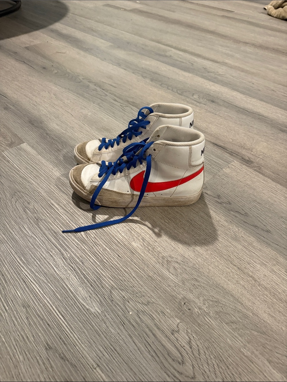 Nike Kids White High-Top Sneakers with Red Swoosh and Blue Laces